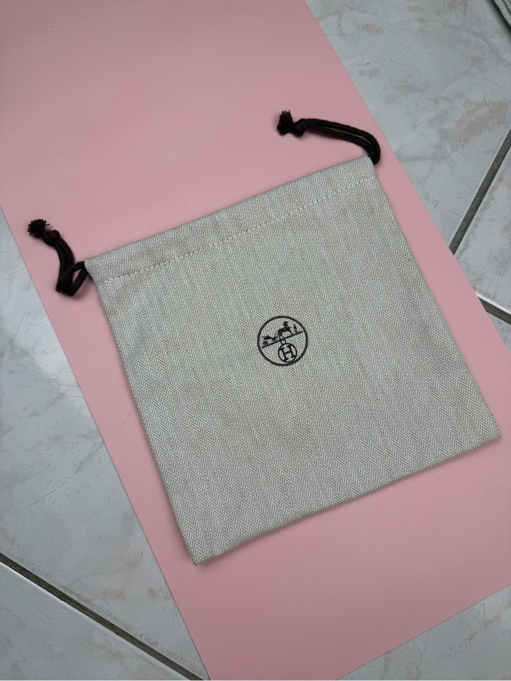 Hermes cream and black herringbone dust bag with carriage logo